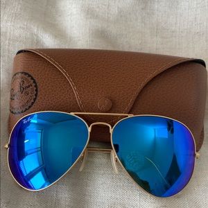 Ray Bans 3025- large aviators with gold frames and blue lens.